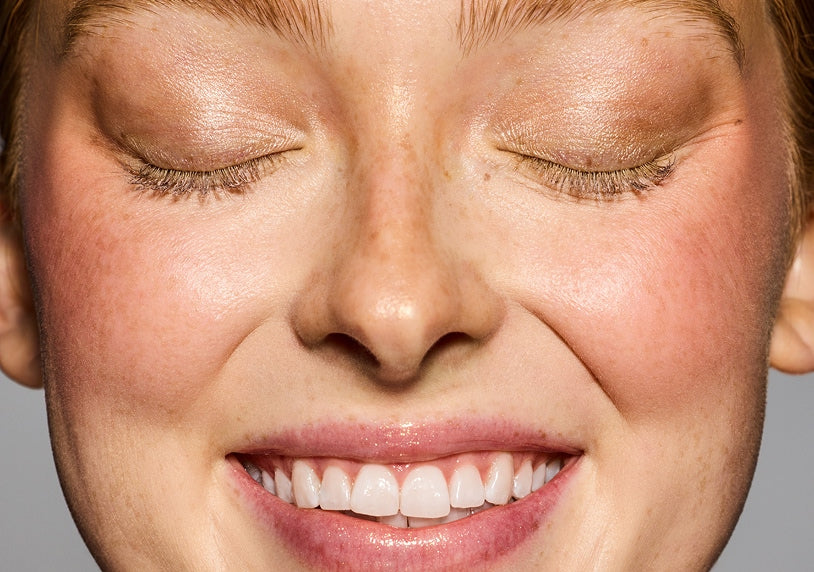 Model with eyes closed wearing Hella Extra Mascara Primer.