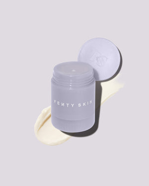 An open container of Thicc N Smooth Rich Peptide eye cream on a lilac background.